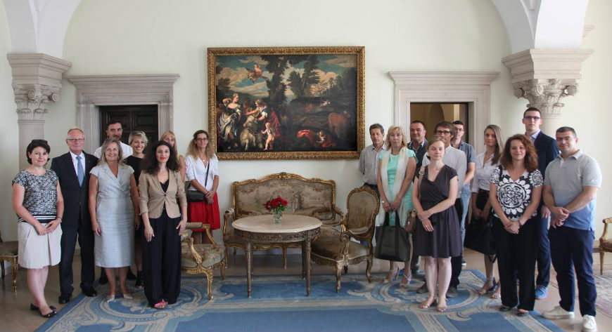 The staff of the Council of Europe Office in Belgrade in the Royal Palace, in front of the painting of ‘Europa’ by Carletto Caliari © Igor Ursić, Photo Archive of the Royal Palace of Serbia