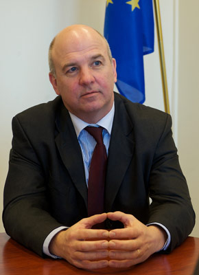 portrait of Nils Muižnieks at his desk in the Office of the Commissioner for Human Rights
