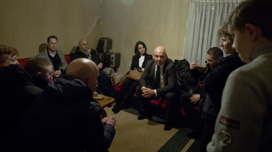 Commissioner for Human Rights Nils Muižnieks, talks to internally displaced ethnic Albanians living in Shipol in the outskirts of Mitrovica, Kosovo.