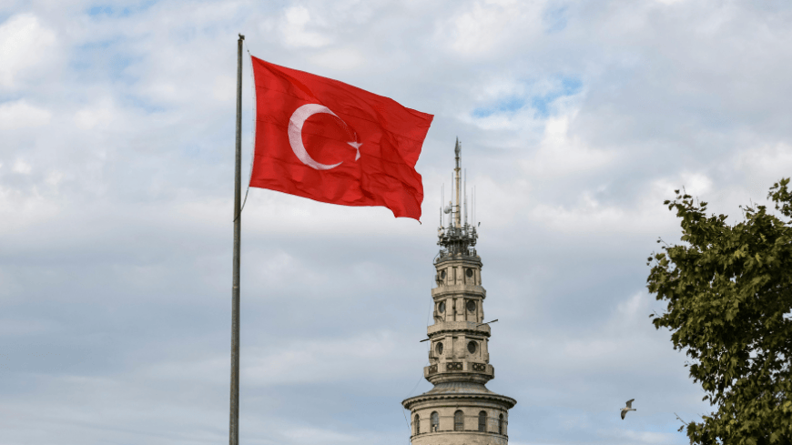 Turkish flag above Beyazit Tower in Istanbul, Türkiye