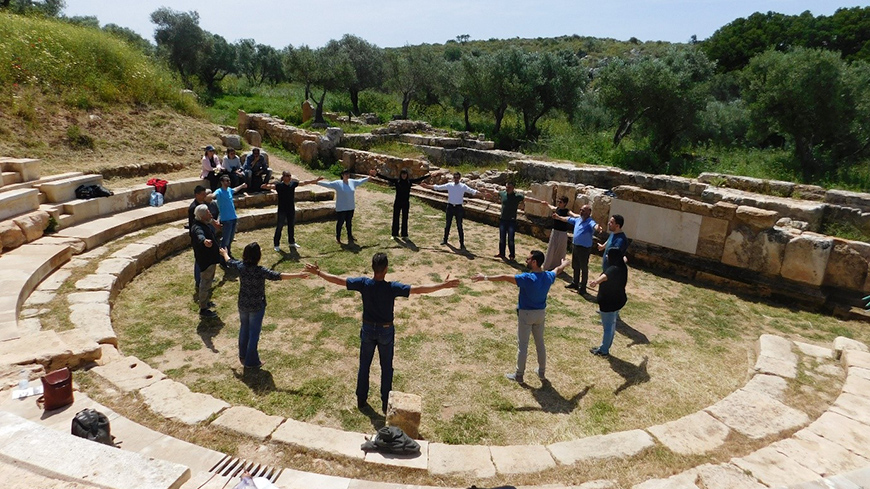 Photo credit: The group dramatizes in the orchestra of the ancient theatre of Aptera© Greek Ministry of Culture and Sports, Ephorate of Antiquities of Chania