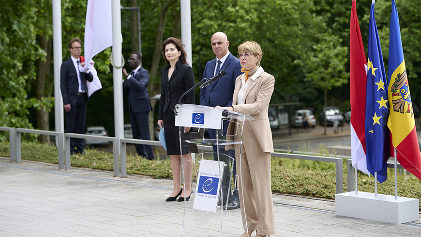 Isabelle Berro-Amadeï speaks as the Monaco flag is raised, alongside Secretary General Berset and Ambassador Daniela Cujbă