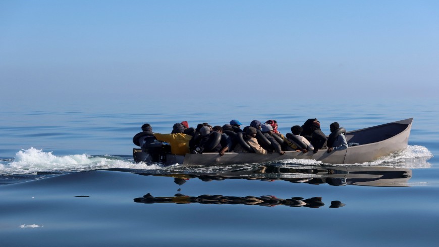 Migrants navigate on a metal boat as they attempt to cross to Italy from Sfax, Tunisia. April 27, 2023. REUTERS/Jihed Abidellaoui