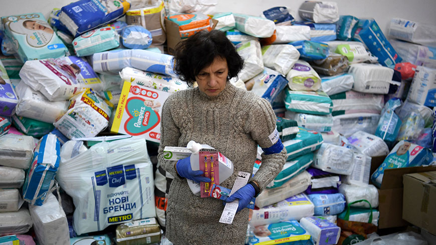 A volunteer works at a donation and distribution center of goods in Lviv, Ukraine on March 2, 2022. Credit: Daniel LEAL/AFP