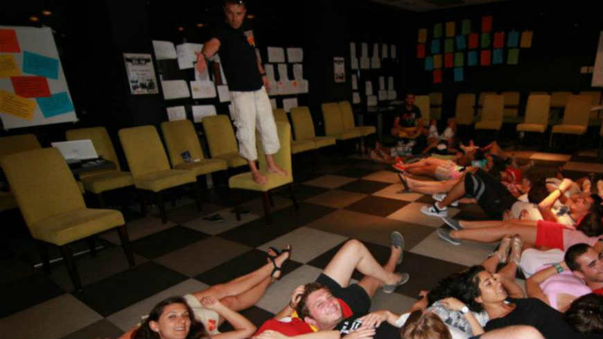 youth lying down on the floor as part of a youth activity